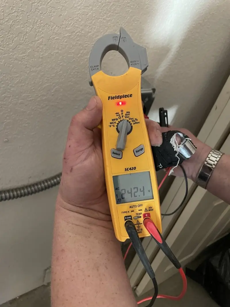 Voltage testing with clamp meter during Electrical Installation Services in Catonsville